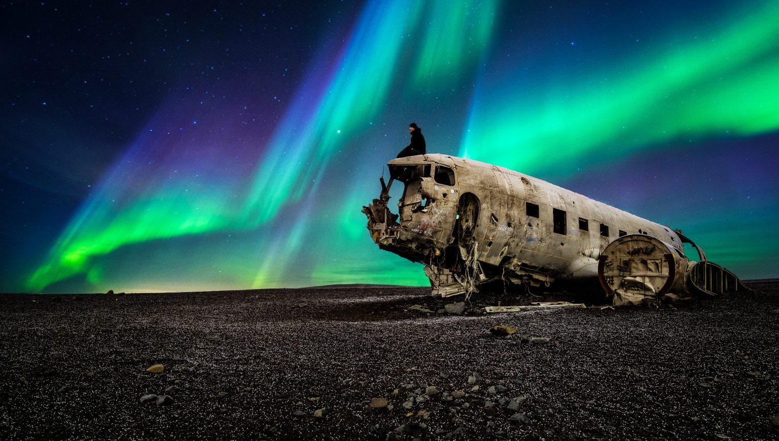 Northern lights over the DC-3 plane wreck at Sólheimasandur, Iceland
